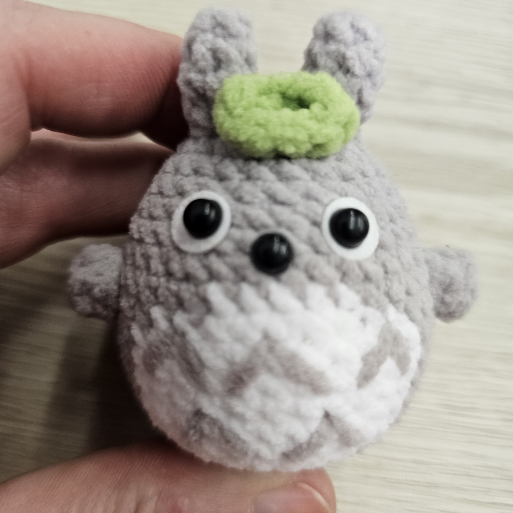 Gray and White Plush Toy with Green Accent